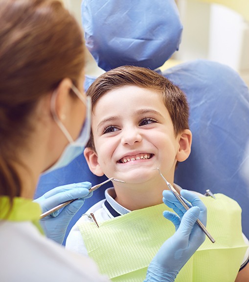 Little boy smiling before dental cleaning